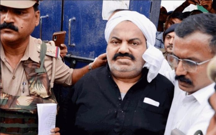 Atiq Ahmed being brought out of Sabarmati jail by jail staff and police officers of Gujarat and UP | Photo by special arrangement