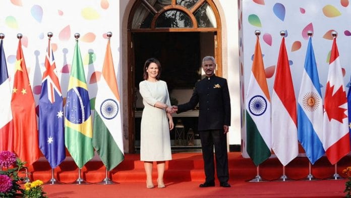German Foreign Minister Annalena Baerbock and India's Foreign Minister Subrahmanyam Jaishankar shake hands before the start of G20 foreign ministers' meeting in New Delhi, India, March 2, 2023. India's Ministry of External Affairs/Handout via REUTERS