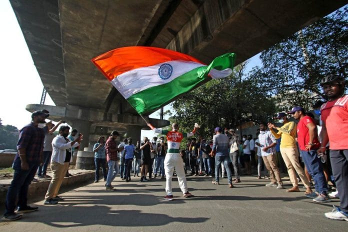 A cricket fan holds an Indian flag | Representational iage | ANI file photo