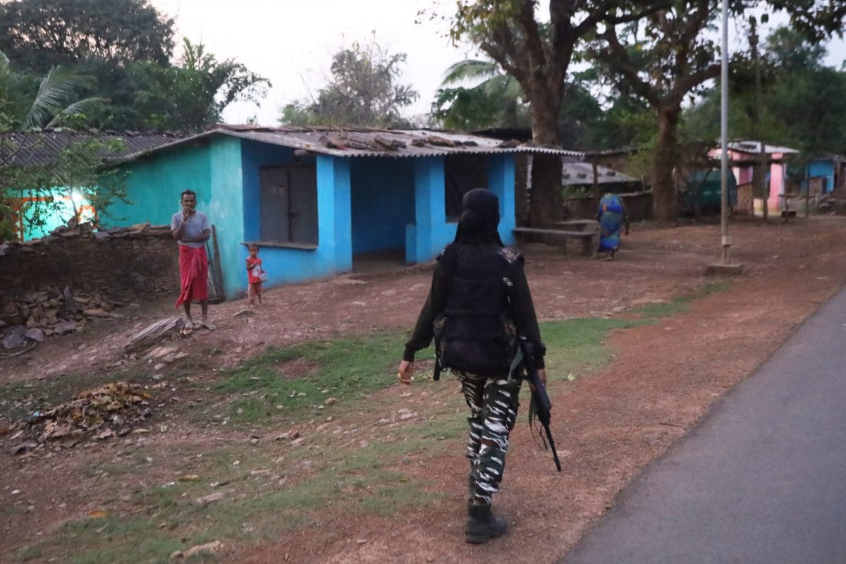 During Road Operation Party, a women personnel walk between the civilians home | Photo: Praveen Jain | ThePrint