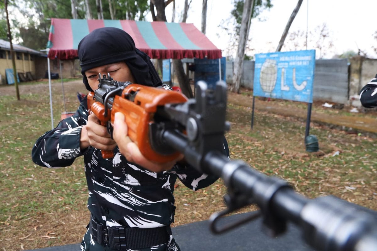 During one of the firing exercises, a woman personnel from new batch holds a rifle | Photo: Manisha Mondal | ThePrint
