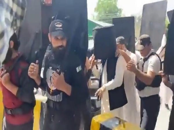 Imran Khan walks into court with bulletproof helmet, human shields in Lahore