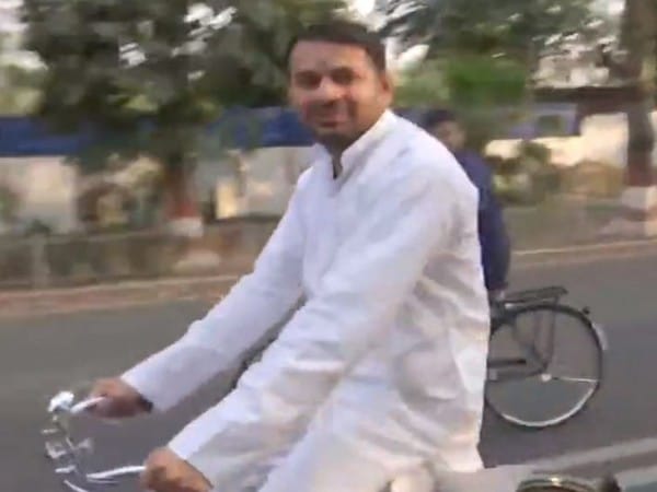 Former CM Lalu Yadav returns to Patna, Tej Pratap rides bicycle in 'delight'