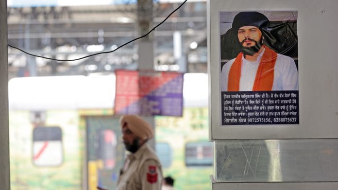 A poster of Amritpal Singh put up by Punjab Police at the Amritsar Railway Station | Photo: ANI Photo