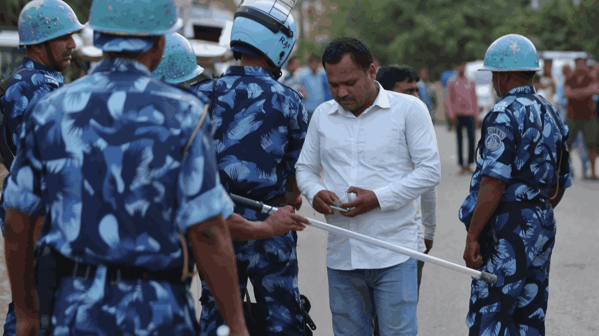 Police and RAF personnel check Aadhaar cards of those wishing to attend the funeral | Suraj Singh Bisht | ThePrint 