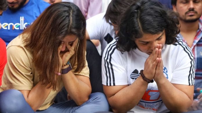 Vinesh Phogat, and Sakshi Malik at wrestlers' protest at Jantar Mantar, New Delhi, Sunday | Manisha Mondal | ThePrint
