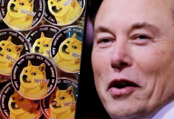A photo of Elon Musk is displayed on a smartphone placed on representations of cryptocurrency Dogecoin in this illustration | Reuters