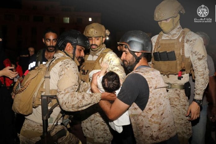 A child looks on as Jordanian citizens and other nationals who were evacuated from Sudan, arrive at Marka Military Airport, in Amman, Jordan, on 24 April 2023 | Reuters