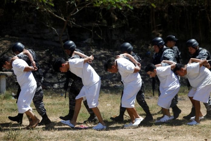 Alleged members of the Barrio 18 gang are presented to the media in Colon, El Salvador | Reuters