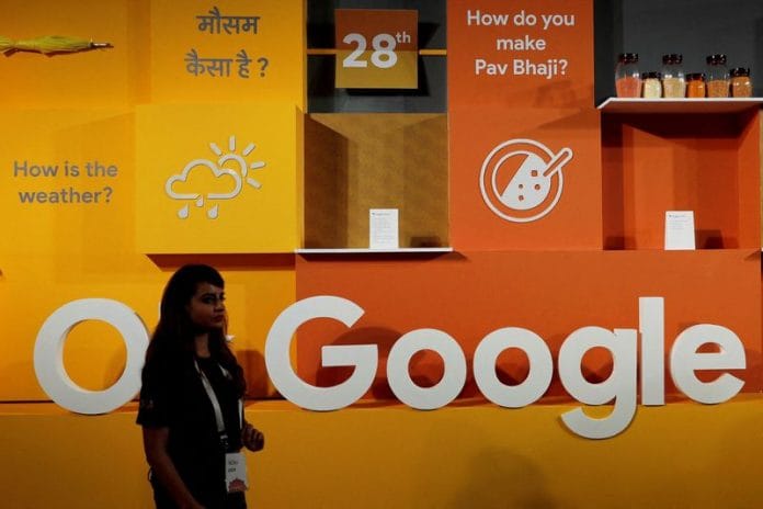 A woman walks past the logo of Google during an event in New Delhi | Reuters file photo