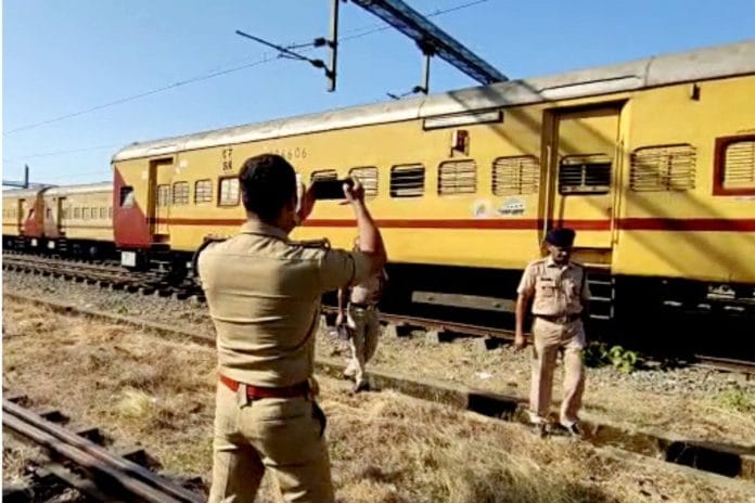Police personnel during an investigation into the train fire incident, in Kozhikode Monday | ANI