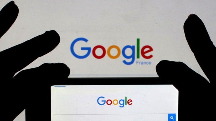 A woman holds her smart phone, which displays the Google home page | File Photo: Reuters