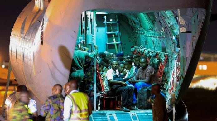 Evacuees from war-torn Sudan sit inside a military plane in Nairobi, Kenya | Reuters