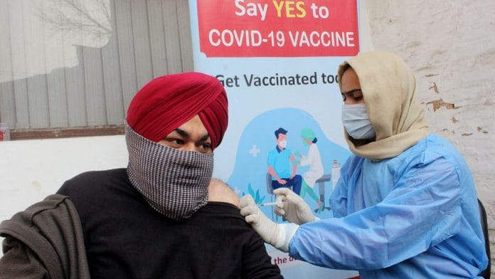 File photo of a health worker administering the covid vaccine | ANI
