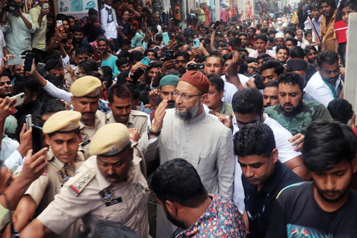 File photo of AIMIM chief Asaduddin Owaisi greeting his supporters | Twitter | @asadowaisi
