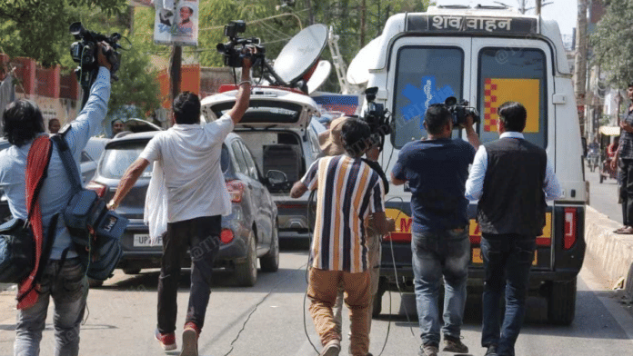 Media persons running of the Ambulance outside the Motilal Nehru Hospital after the x- ray taken of the body of Atiq Ahemd and brother AshrafMedia persons running behind the ambulance outside the Motilal Nehru Hospital after the x- ray taken of the body of Atiq Ahmed and brother Ashraf | Suraj Singh Bisht |ThePrint