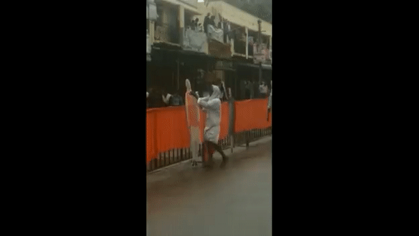 Karnataka man wipes rainwater from cutouts of PM Modi in Devanahalli