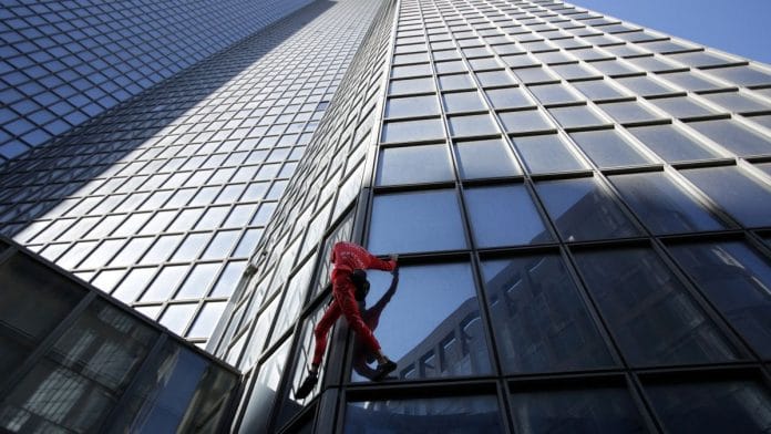 'French Spiderman' climber, Alain Robert, climbs the TotalEnergies skyscraper in La Defense near Paris | Reuters file photo