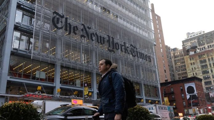 A pedestrian walks by the New York Times building in Manhattan, New York | Reuters file photo