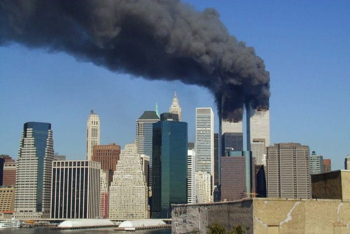 Plumes of smoke billow from the World Trade Center towers in Lower Manhattan, New York City, after a Boeing 767 hits each tower during the September 11 attacks | Commons