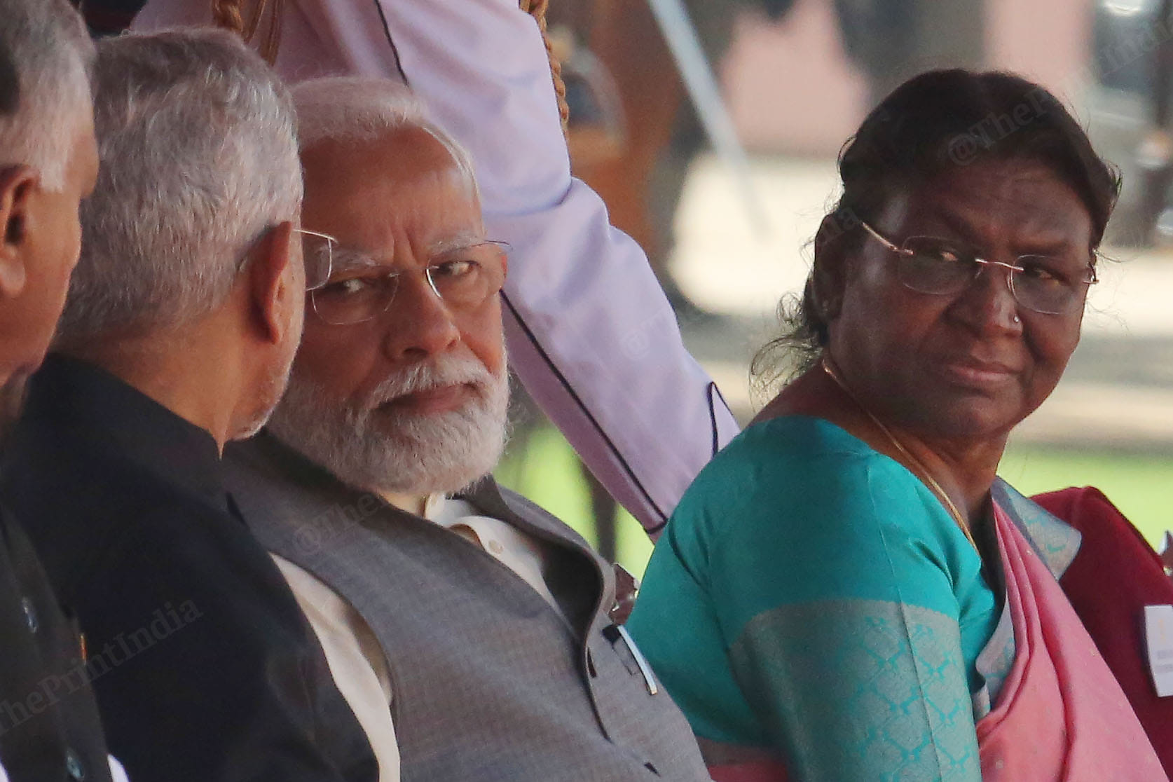President Murmu looks at PM Modi as he talks to external affairs minister S, Jaishankar | Photo: Praveen Jain | ThePrint