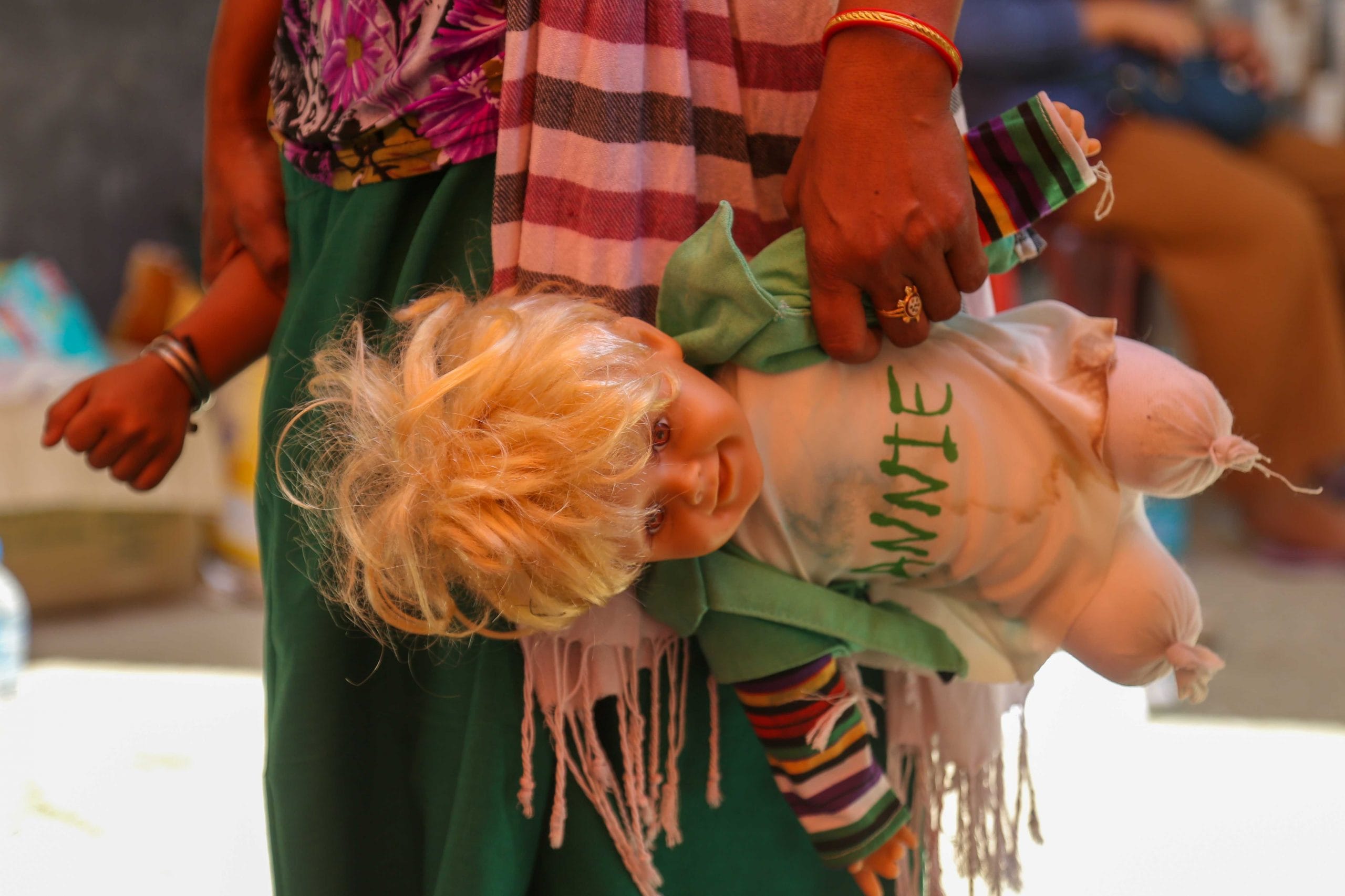 A pregnant woman holds her child's hand at a relief camp set up at Imphal's Khuman Lampak Sports Complex | Suraj Singh Bisht | ThePrint