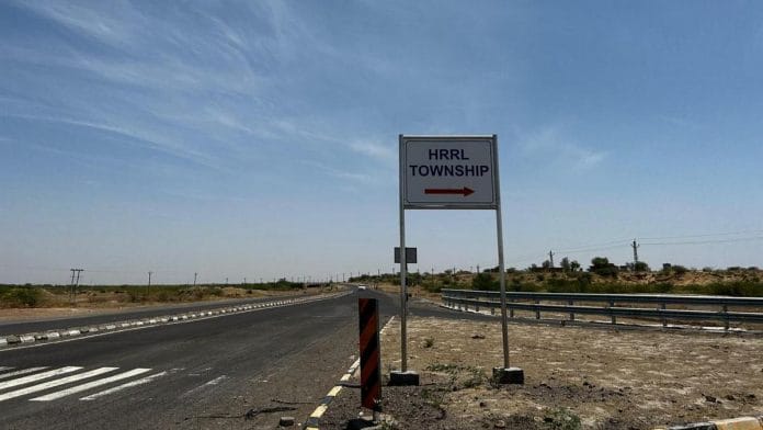 Sign pointing to HRRL township in Barmer