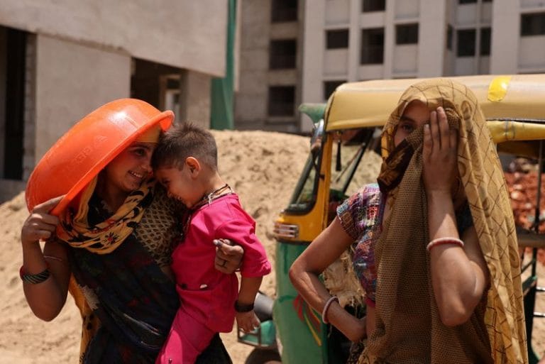 Poor workers in Gujarat enroll in one of world’s first insurance schemes for extreme heat