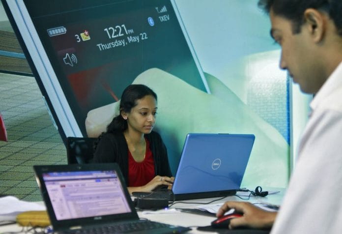 Employees work on their laptops at the Start-up Village in Kinfra High Tech Park in the southern Indian city of Kochi | Reuters file photo