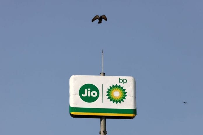 A bird flies over the logo of Jio-b, outside a fuel station in Navi Mumbai | Reuters file photo