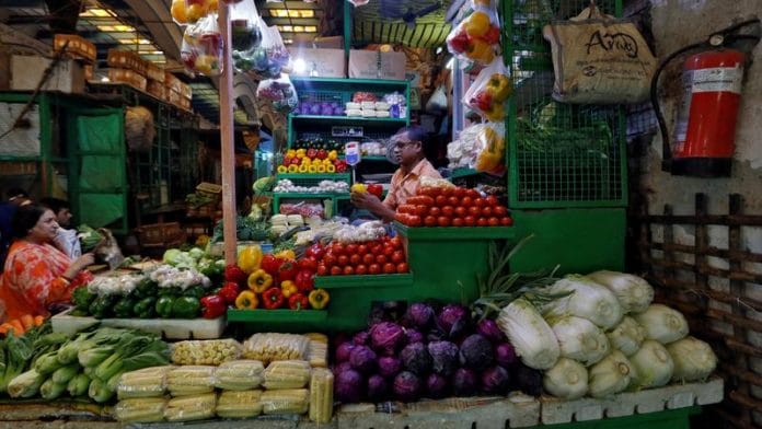 A vendor sells vegetables at a retail market in Kolkata | File Photo: Reuters