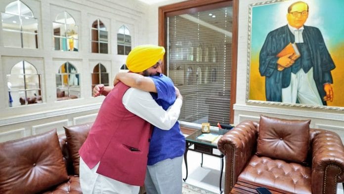 Delhi CM and AAP chief Arvind Kejriwal greets Punjab CM Bhagwant Singh Mann after the party’s win in the Jalandhar Lok Sabha byelection, in New Delhi Saturday | ANI