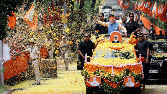 Prime Minister Narendra Modi during a roadshow for the Karnataka Assembly elections in Bengaluru Saturday | ANI