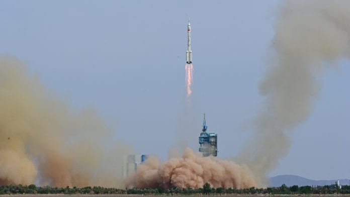 A Long March-2F carrier rocket, carrying the Shenzhou-16 spacecraft and 3 astronauts, takes off from the launching area of Jiuquan Satellite Launch Center for a crewed mission to China's Tiangong space station, near Jiuquan, Gansu province, China, on 30 May 2023 | China Daily via Reuters