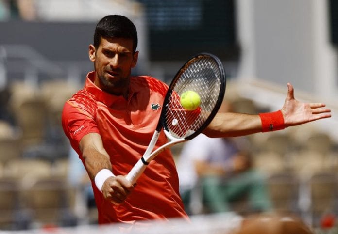 Serbia's Novak Djokovic warms up before his first round match against Aleksandar Kovacevic at the French Open on 29 May 2023 | Photo: Reuters