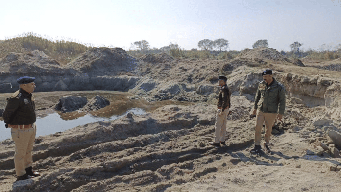 Una SP Arjit Sen Thakur with his team at an illegal mining site | By Special Arrangement.