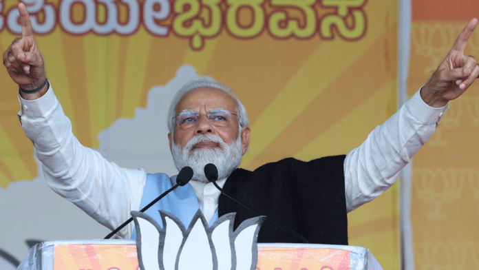 PM Narendra Modi addresses a BJP poll rally Tuesday in Karnataka | Twitter | @BJP4Karnataka .