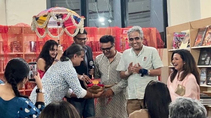 Yash, author Rasika Bhatia (far right)’s husband and co-wedding planner, launching the book (in a golden orb) on a makeshift mandap. | Humra Laeeq/ThePrint