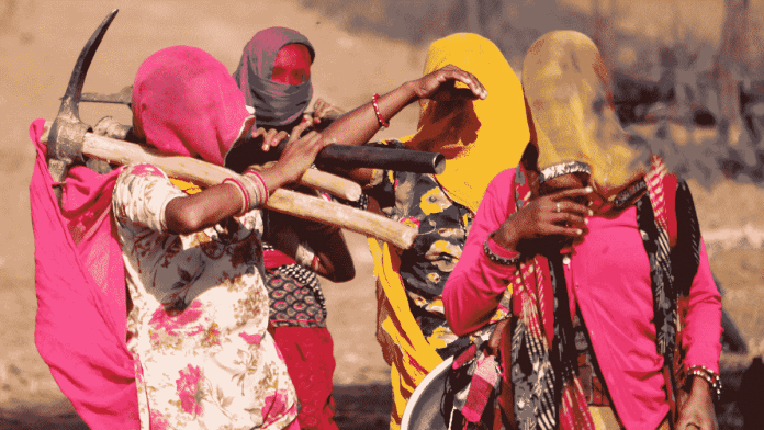  Women labourers carry their equipment as they go to work under the MGNREGA during the COVID-19 lockdown in Ajmer | ANI