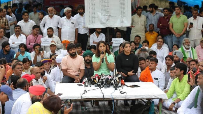 File photo of wrestlers Bajrang Punia, Vinesh Phogat (centre) and Sakshi Malik at Jantar Mantar | Suraj Singh Bisht | ThePrint