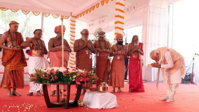 PM Narendra Modi bows before the sengol at the ceremony to mark the inauguration of the new Parliament building | Photo: ANI