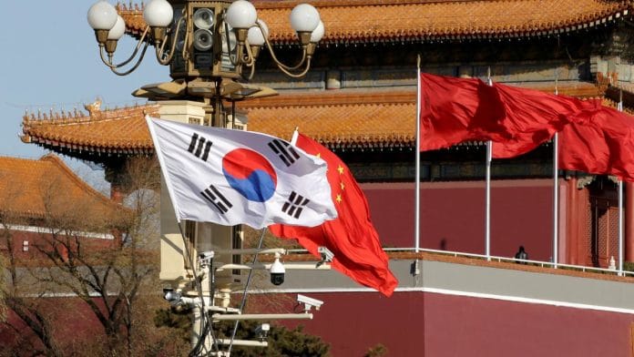 South Korea and China's flags flutter next to Tiananmen Gate during the visit of South Korean President Moon Jae-In in Beijing, China | Reuters