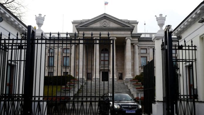 A car leaves through the gate of the Russian embassy building in Warsaw, Poland | Reuters