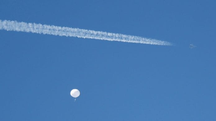 A jet flies by a suspected Chinese spy balloon as it floats off the coast in Surfside Beach, South Carolina, US | Reuters file photo