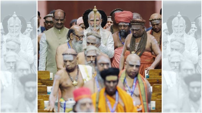Prime Minister Narendra Modi carries the 'Sengol' to install it at the new Parliament building | ANI file photo