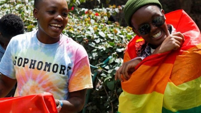 Participants react with Pride rainbow flags as they attend the Badilika festival to celebrate the LGBT rights in Nairobi, Kenya, June 11, 2023/Reuters
