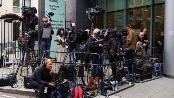 Media wait outside the Rolls Building of the High Court on the day, when Britain's Prince Harry, Duke of Sussex is set to arrive, in London | Reuters/Hannah McKay