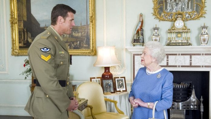 Australian SAS Corporal Ben Roberts-Smith (L) with Britain's Late Queen Elizabeth II | Reuters
