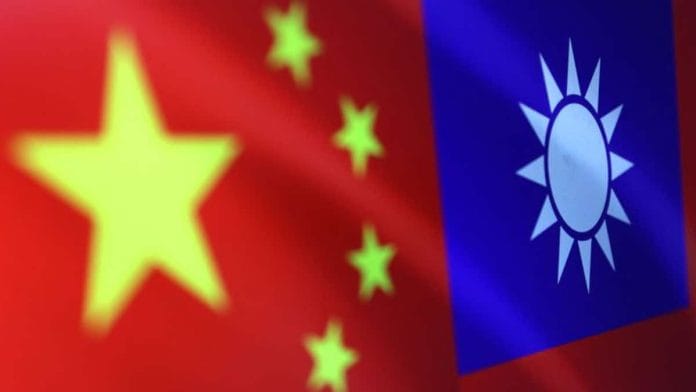 Chinese and Taiwanese flags are seen in this illustration/Image via Reuters