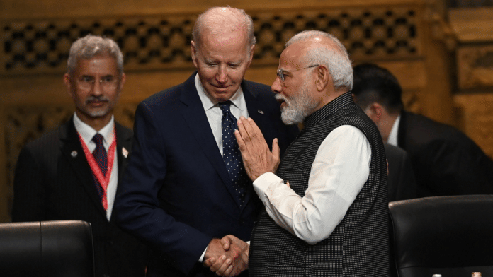 US President Joe Biden speaks with PM Narendra Modi at the G20 Summit opening session in Nusa Dua, Bali, Indonesia | PRASETYO UTOMO/G20 Media Center/Handout via Reuters file photo